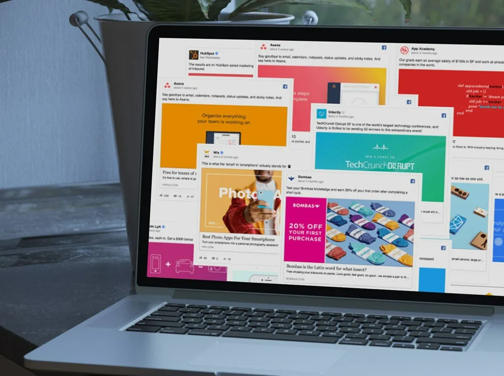 A laptop screen crowded with overlapping promotional pop-ups and advertising panels